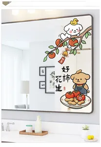 Detail of dog pattern glass stickers with persimmons and peanuts on a bathroom mirror