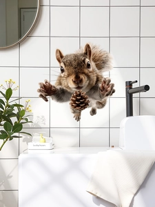 3D realistic squirrel wall decal holding a pinecone on a white tiled bathroom wall