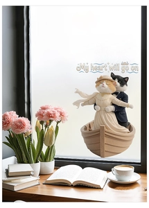 Detail of 3D cartoon cat window sticker on glass with soft indoor morning lighting