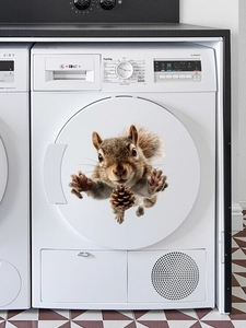 3D squirrel decal with pinecone on a white washing machine door in a modern laundry room