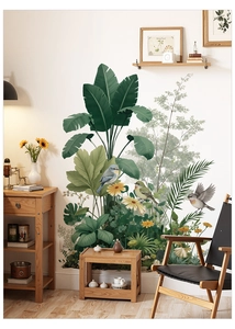 Macro detail of tropical palm leaf wall stickers with colorful birds in a warm living room