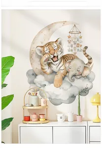 Detail of cartoon tiger and elephant wall decals on moon and clouds in kid bedroom
