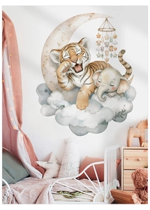 Detail of watercolor baby elephant and tiger wall stickers in a cozy child room setup