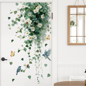 Nature wall sticker with white daisies, green vines, blue birds, and butterflies on door