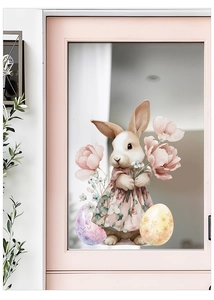 Detail view of Easter bunny window decal with floral dress and colorful eggs on glass