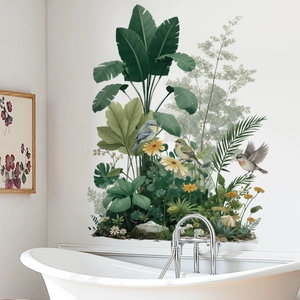 Tropical palm leaves and birds wall decal decoration above a modern white bathtub