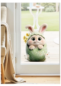 Detailed view of an Easter bunny window sticker on a glass door with floral egg patterns