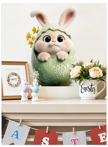 Close-up of Easter window sticker featuring a cute bunny in floral egg on a white mantel