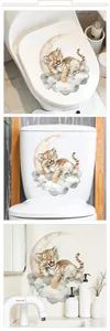 Close-up of cute cartoon tiger and elephant stickers on a white toilet lid surface