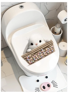Detail of Easter bunny toilet decals with white rabbit and colorful eggs on white marble