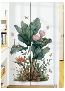 Detailed view of banana leaves and lotus floral wall stickers on a white closet surface