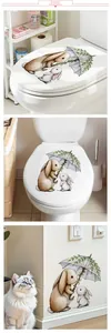 Detail of cute vine umbrella bunny stickers on toilet lid and nursery wall