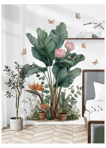 Detailed interior view of tropical palm leaves and bird wall stickers on a bedroom wall
