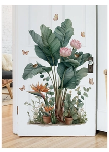 Detailed watercolor plant wall stickers featuring banana leaves and lotus on a white door