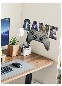 Détail d'un sticker mural manette de jeu avec texture galaxie pour déco de chambre
