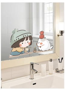 Detail of cute girl and pet cartoon sticker on bathroom mirror surface with soft lighting
