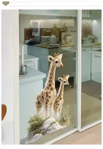 Detail view of UV printed giraffe wall stickers applied on glass door with rocky base