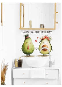Detail of avocado couple window cling with Happy Valentine's Day text on white wall