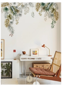 Detail of tropical monstera and palm leaf wall stickers in elegant Morandi tones