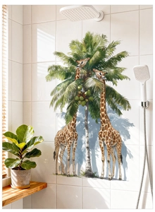 Detail of giraffe and palm tree wall decal on white tiles in a bathroom setting