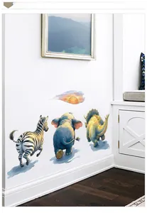 Detail of watercolor zebra and elephant wall decals applied on a white living room wall
