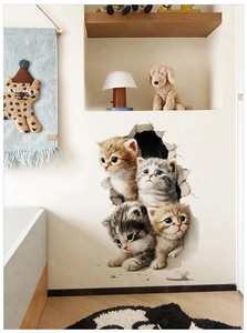 Detail showing 3D wall stickers with four cute cats peering through realistic cracked walls