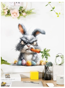 Détail de l'autocollant lapin de Pâques en colère avec des œufs sur un mur blanc
