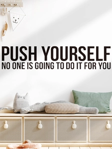 Detail of inspirational push yourself black vinyl wall sticker in modern home interior