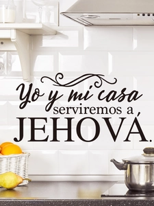 Detail of Spanish religious wall sticker with text on a white tiled kitchen wall