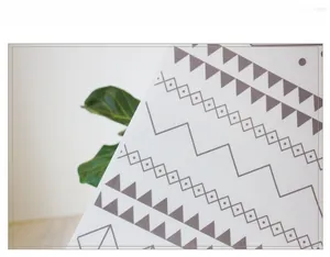 Detail of white frosted glass film with grey Moroccan geometric tile pattern