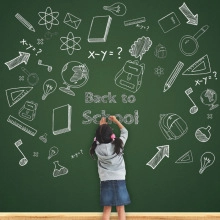 Close-up of Back to School green chalkboard backdrop with hand-drawn campus doodles
