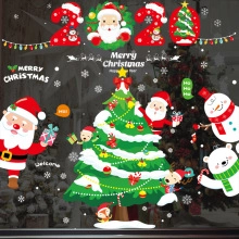 Close-up of static Christmas window stickers with Santa, tree and reindeer designs