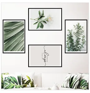 Modern Nordic wall art set featuring white flowers and tropical green leaves on white wall