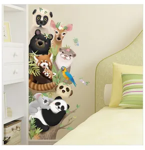 Detail of hand-painted cartoon animal wall stickers including pandas and koalas for nursery decor