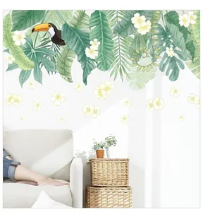 Detail of tropical plant wall stickers with palm leaves and toucan bird for home decor