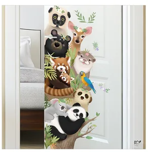Detailed view of colorful cartoon forest animal stickers on a white bedroom door surface