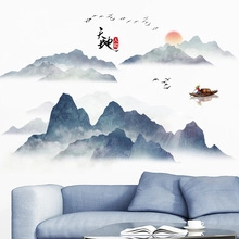 Detail of Chinese ink wash landscape wall sticker with mountains, birds, and red sun