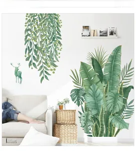 Détail de stickers muraux feuilles tropicales nordiques et silhouette de cerf vert