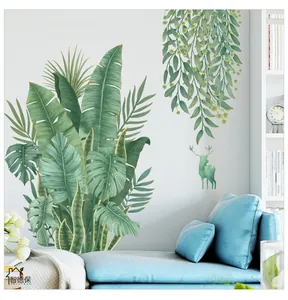 Détail de stickers muraux en PVC de feuilles tropicales avec silhouette de cerf vert
