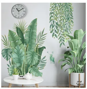 Détail de stickers muraux feuilles de bananier avec silhouette d'élan et texte