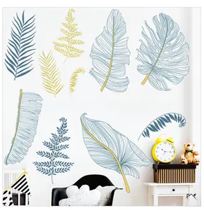 Detail of Nordic plant wall stickers featuring blue and yellow monstera leaf designs