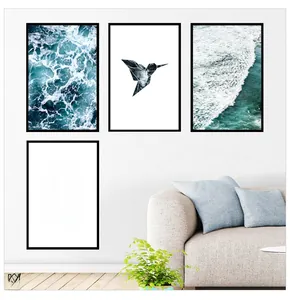 Set of four modern wall art pieces featuring blue waves and minimalist geometric birds