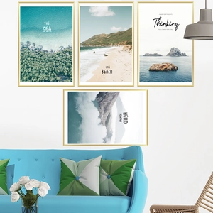Set of 4 modern nature wall art prints with gold frames featuring sea and beach landscapes