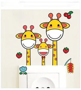 Close-up of cartoon deer family and rainbow wall stickers around a white wall socket