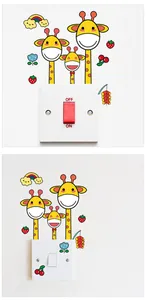 Detail of cute giraffe cartoon switch stickers with rainbow and strawberry wall decor elements