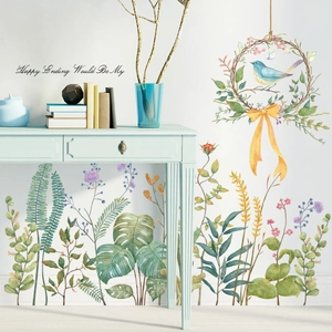 Nordic watercolor wall decals featuring green leaves, birds and happy ending text