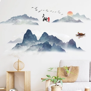 Ink landscape self-adhesive wallpaper featuring misty mountains and a red sun in a living room