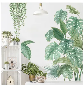 Detail of tropical monstera deliciosa and palm leaf wall stickers in a home interior