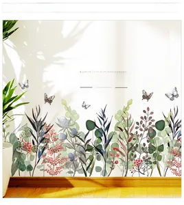Detail showing watercolor green leaf wall stickers with butterfly and berry accents