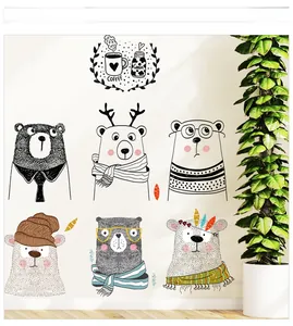 Detail showing cartoon bear wall decals with coffee icons on a minimalist home wall